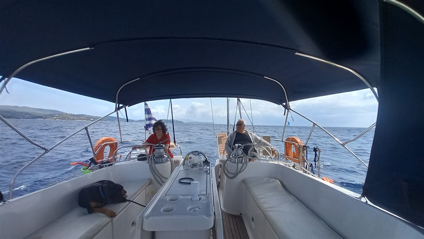 Guests relaxing in the shaded cockpit under way